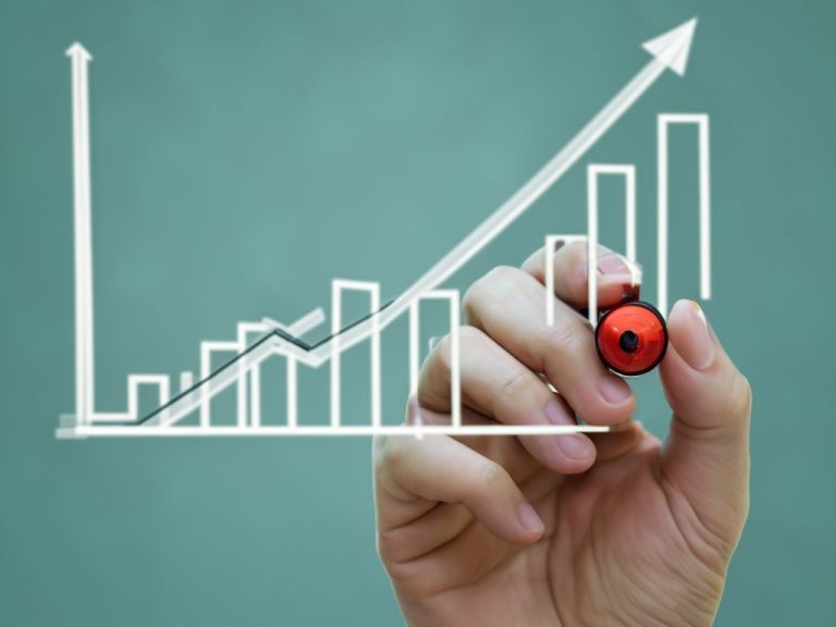 Property Success Hand drawing an upward trend on a graph labelled "Property Success."